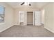 Main bedroom with carpet, ceiling fan, and ensuite bathroom access at 2329 Wilkins Cv, Decatur, GA 30035