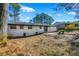 Large backyard with mature trees and patio at 1933 Glen Echo Dr, Decatur, GA 30032