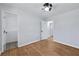 Bedroom with hardwood floors and access to other rooms at 1933 Glen Echo Dr, Decatur, GA 30032