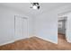 Bright bedroom with hardwood floors and ceiling fan at 1933 Glen Echo Dr, Decatur, GA 30032