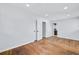 Well-lit bedroom with hardwood floors and access to bathroom at 1933 Glen Echo Dr, Decatur, GA 30032