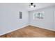 Well-lit bedroom featuring hardwood floors and a window at 1933 Glen Echo Dr, Decatur, GA 30032
