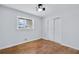 Bedroom with hardwood floors, neutral walls and sliding door closet at 1933 Glen Echo Dr, Decatur, GA 30032