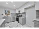 Updated kitchen featuring gray cabinets and marble flooring at 1933 Glen Echo Dr, Decatur, GA 30032