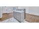 Modern kitchen with gray cabinets, quartz countertops and marble backsplash at 1933 Glen Echo Dr, Decatur, GA 30032