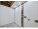 Unfinished laundry room with exposed brick and flooring at 1933 Glen Echo Dr, Decatur, GA 30032