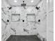 Spa-like shower with marble tile and multiple shower heads at 1933 Glen Echo Dr, Decatur, GA 30032