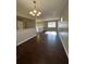 Open living room with hardwood floors and a chandelier at 5548 Downs Ct, Lithonia, GA 30058