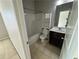 Clean and bright secondary bathroom with a tub/shower combo and vanity at 566 Mariposa Ln, Mcdonough, GA 30253