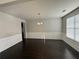 Elegant dining room with dark hardwood floors, chandelier lighting, and wainscoting at 566 Mariposa Ln, Mcdonough, GA 30253