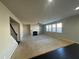 Spacious living room with fireplace, carpet, and ceiling fan at 566 Mariposa Ln, Mcdonough, GA 30253