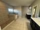 Large main bathroom featuring a separate tub, walk-in shower, and dual vanity at 566 Mariposa Ln, Mcdonough, GA 30253