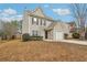 Front view of a two-story home with an attached garage and driveway at 7030 Setters Way, Lithonia, GA 30038