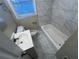 Bathroom with tiled floors and bathtub at 2030 Shamrock Dr, Decatur, GA 30032
