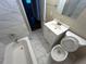 Updated bathroom with a bathtub, toilet and vanity at 2030 Shamrock Dr, Decatur, GA 30032