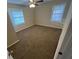 Bedroom with carpet, ceiling fan, and two windows at 2030 Shamrock Dr, Decatur, GA 30032