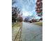 Residential street with houses and trees on either side at 985 James Ridge Dr, Lawrenceville, GA 30045