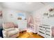 Bright Bedroom features a crib, dresser, and comfy chair at 24 Daniel Se St # 8, Atlanta, GA 30312