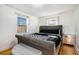 Bedroom with gray upholstered bed, hardwood floors, and ample natural light at 24 Daniel Se St # 8, Atlanta, GA 30312