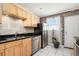 Kitchen with light wood cabinets, granite countertops, and stainless steel appliances at 24 Daniel Se St # 8, Atlanta, GA 30312