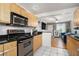 Kitchen with light wood cabinets, granite countertops, and stainless steel appliances at 24 Daniel Se St # 8, Atlanta, GA 30312