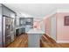 Modern kitchen with gray cabinets, stainless steel appliances, and a kitchen island at 1035 Stonewall Se Dr, Atlanta, GA 30315