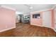Living room, hardwood floors, pink walls, kitchen at 1035 Stonewall Se Dr, Atlanta, GA 30315