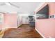Living room with hardwood floors and kitchen view at 1035 Stonewall Se Dr, Atlanta, GA 30315