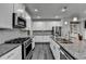 Modern kitchen with stainless steel appliances and granite countertops at 4215 Essex Pond Way, Cumming, GA 30040