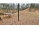 Spacious backyard with a covered wooden structure, nestled among trees at 7460 Highway 101 N, Rockmart, GA 30153