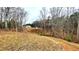 Home nestled among trees on a wooded lot at 7460 Highway 101 N, Rockmart, GA 30153