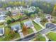 Aerial view of homes in a quiet neighborhood with green lawns and trees at 2635 General Lee Way, Buford, GA 30519