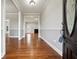 Hardwood foyer with two-tone painted walls and view into living room at 2984 Berry Rd, Loganville, GA 30052