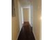 Long hallway with hardwood floors leading to multiple rooms at 309 Fletcher Sw St, Atlanta, GA 30315
