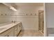 Modern bathroom with double vanity, glass shower, and white subway tile at 2689 Richmond Row, Suwanee, GA 30024
