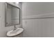 Powder room with pedestal sink, modern faucet, large mirror, and white shiplap walls at 2689 Richmond Row, Suwanee, GA 30024