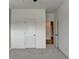 Unfurnished bedroom with open door to another room at 2689 Richmond Row, Suwanee, GA 30024