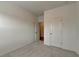 Unfurnished bedroom with neutral carpet, white walls, and a closet with white doors at 2689 Richmond Row, Suwanee, GA 30024