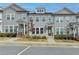 Attractive townhome exterior with gray siding, white trim, and a welcoming walkway at 2689 Richmond Row, Suwanee, GA 30024