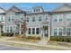 Beautiful townhome with gray siding, white trim, and landscaping details at 2689 Richmond Row, Suwanee, GA 30024