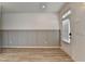 Welcoming foyer with hardwood floors, board and batten wall details, and natural light at 2689 Richmond Row, Suwanee, GA 30024