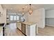 Modern kitchen with white shaker cabinets, granite counters, and stainless steel appliances at 2689 Richmond Row, Suwanee, GA 30024