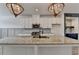 Close-up of a kitchen island with granite countertops, and stainless steel appliances at 2689 Richmond Row, Suwanee, GA 30024