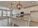 Modern kitchen with an island, stainless steel appliances, and ample counter space at 2689 Richmond Row, Suwanee, GA 30024