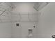 Laundry room with wire shelving and hookups for washer and dryer at 2689 Richmond Row, Suwanee, GA 30024