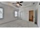 Spacious main bedroom with plush carpet, tray ceiling, and lots of natural light at 2689 Richmond Row, Suwanee, GA 30024