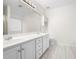 Bathroom boasts double vanity and updated tile flooring at 3041 Lexington Ave, Woodstock, GA 30189