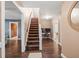 Staircase with brown carpet and hardwood floors at 405 Tanner Rd, Dacula, GA 30019