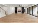 Basement living room with fireplace, built-in shelves, and wood floors at 6214 Talmadge Nw Way, Acworth, GA 30101