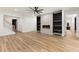 Basement living area with fireplace, wood floors, and staircase at 6214 Talmadge Nw Way, Acworth, GA 30101